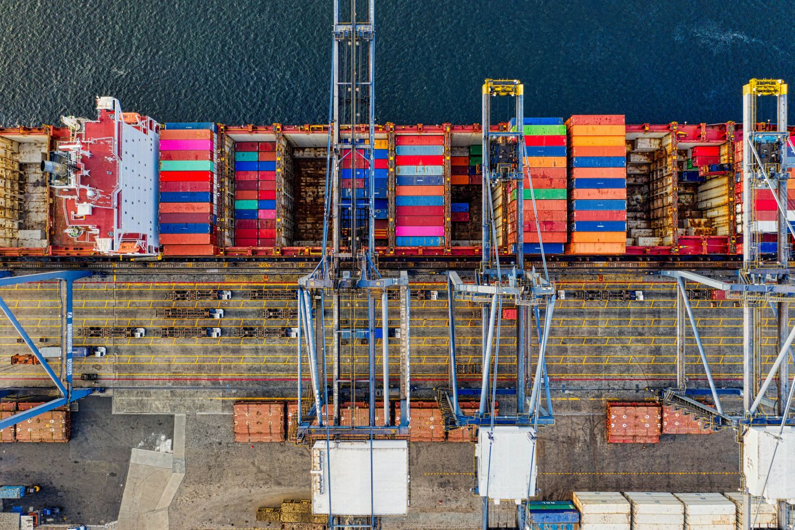 Port operations in progress alongside a berthed vessel
